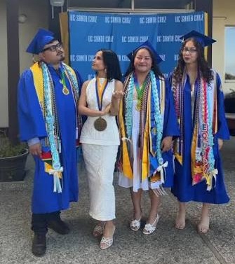 Becky G posing with graduates at a graduation and education celebration.